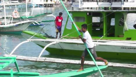 Asian fishermen aligning bangka boats at Coron Island, Palawan, Philippines