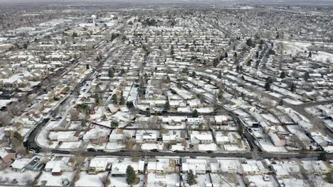 Drone-pans-over-snowy-neighborhood