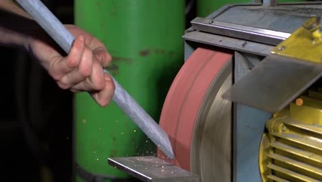sparks-flying-of-a-belt-sander-in-super-slow-motion-while-a-metal-worker-is-doing-his-job