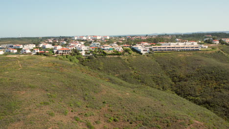 aerial: vacation homes on top of the cliffs of arrifana