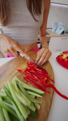 a person chopping vegetables in a kitchen