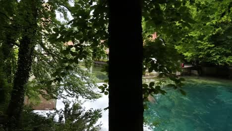view on the crystal clear water of blautopf lake in blaubeuren, swabian alb, germany