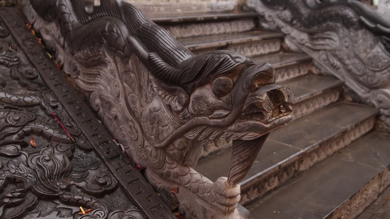 stone dragon leading up stairs to ancient temple in the mountainous region of Ninh Ninh in Northern Vietnam
