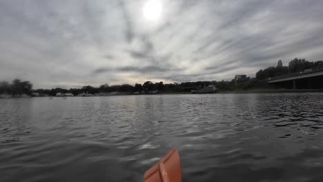 paddle through the tranquil waters of the river hamble under an overcast sky in this serene, unpopulated landscape. experience the calming reflections and gentle ripples