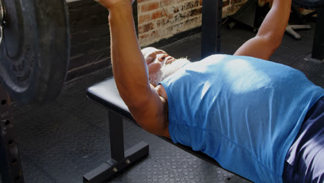 senior man exercising with barbell 4k