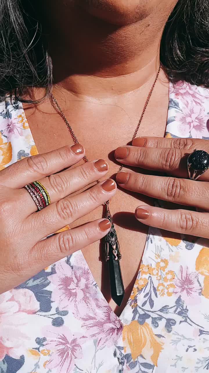 Woman wearing jewelry with floral dress