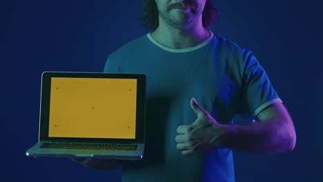 man holding laptop with empty screen