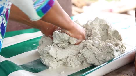 Mexican-woman-preparing-dough-to-make-tortillas-old-school-technique