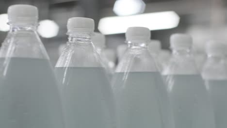 conveyor belt with bottles of drinking water at a modern beverage plant