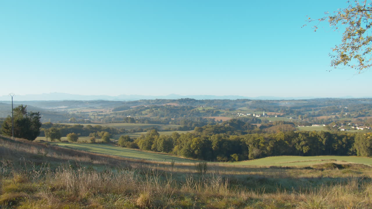 View of green pastures from top of the hill flat sunny horizon rural area