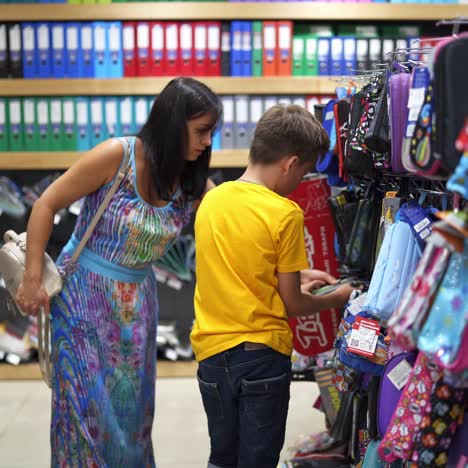 boy choosing stationery for school
