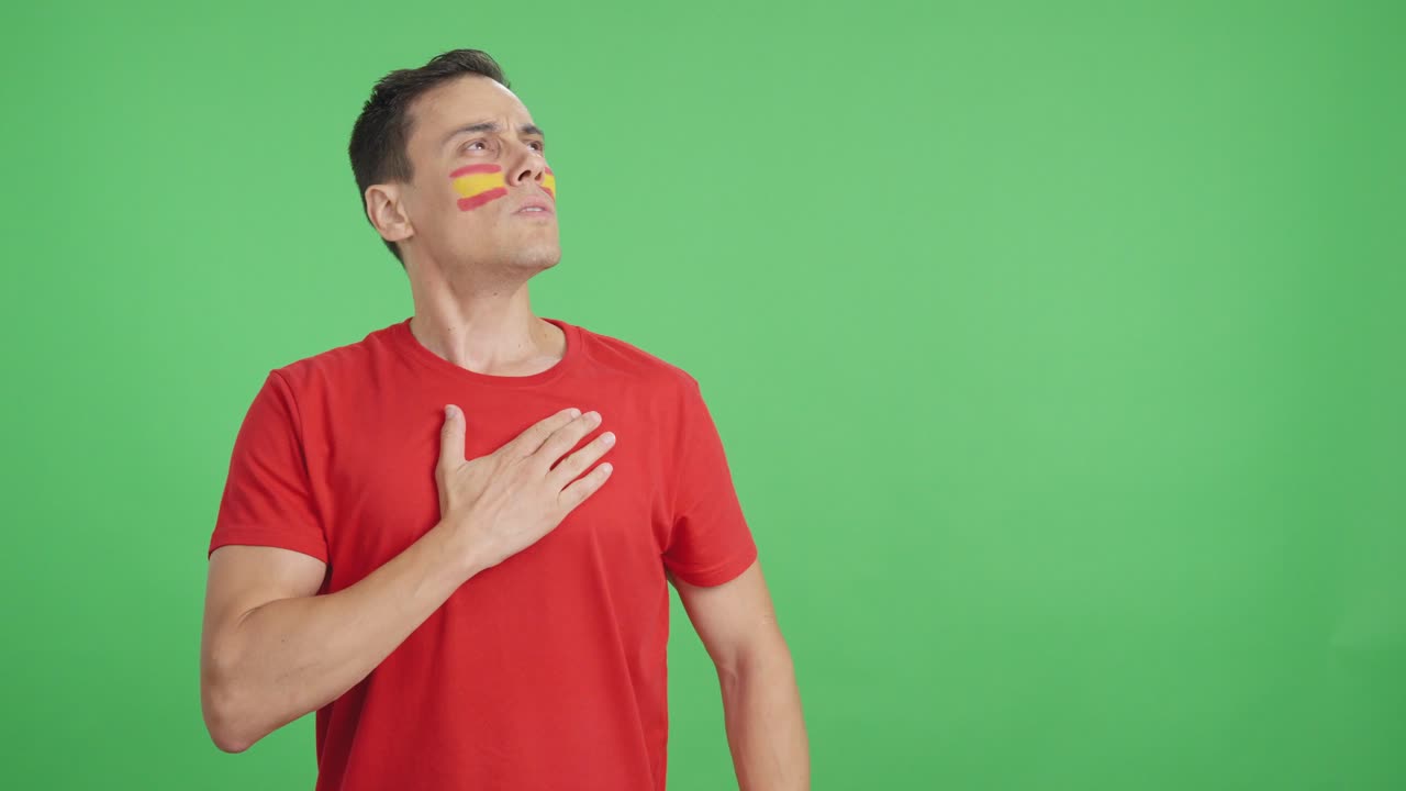 Spanish patriot listening to the national anthem with solemnity