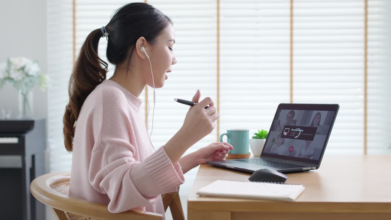 Side view young asian woman employee work from home using computer notebook videocall meeting conference angry annoy with low poor unreliable internet wifi connection problem issue outage.