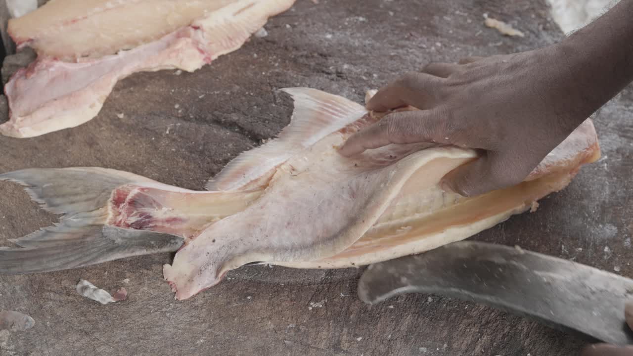 fresh fish cutting at retail shop for sale at day from different angle
