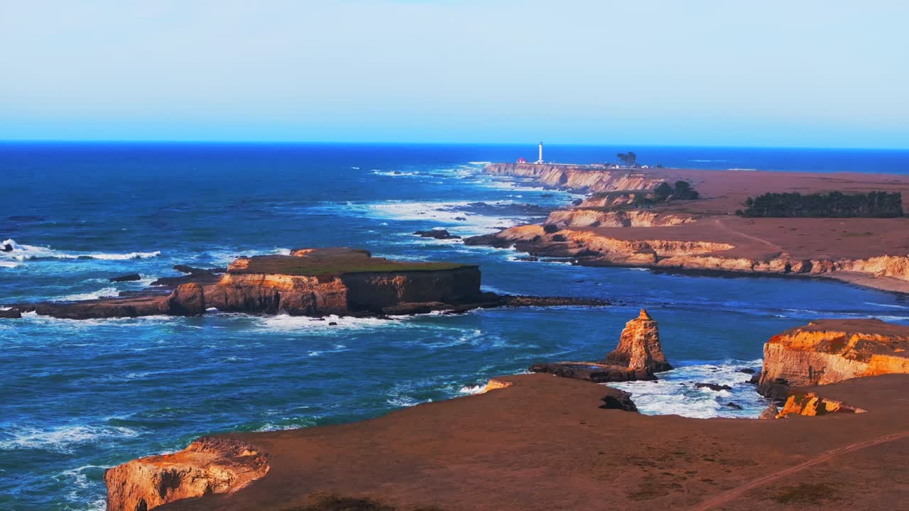 Point Arena Lighthouse Sea Lion Rocks Cove Racas California aerial drone Stornetta coastal Trail Mendocino coast sunny daytime morning afternoon blue sky waves vista point scenic view circle right