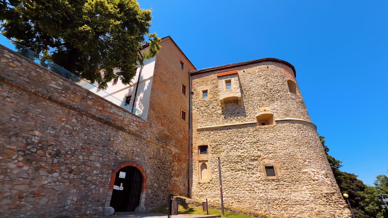 Bratislava, Slovakia, 2 June 2025: Unapproachable walls of the old Bratislava Castle. Low angle view at the famous landmark in the capital of Slovakia
