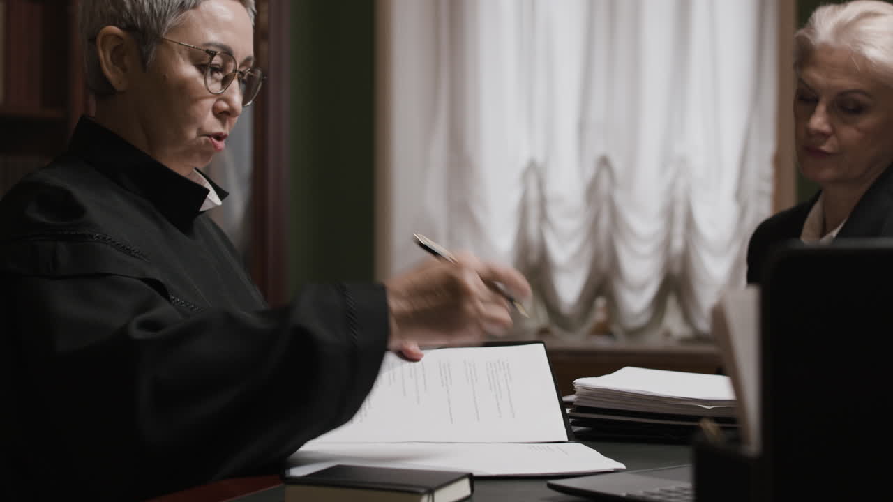 Lawyers Discussing Documents in a Meeting