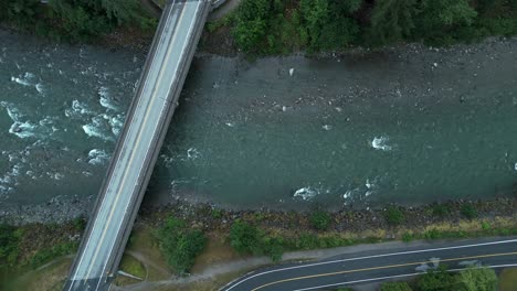 bridge spanning the river in hope, british columbia province, canada. - aerial shot
