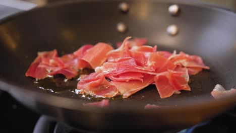 fried ham in a pan close-up