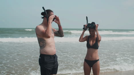 couple putting goggles on