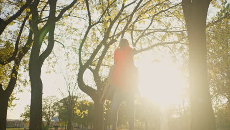couple enjoying a piggyback ride in the park