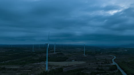 a wind turbine stopping in a dark moody