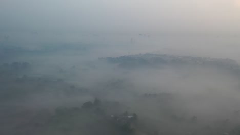 misty sunrise over a town