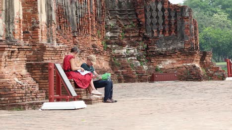 man and woman consulting a map together outdoors.