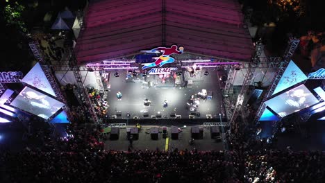 nighttime outdoor concert with large crowd