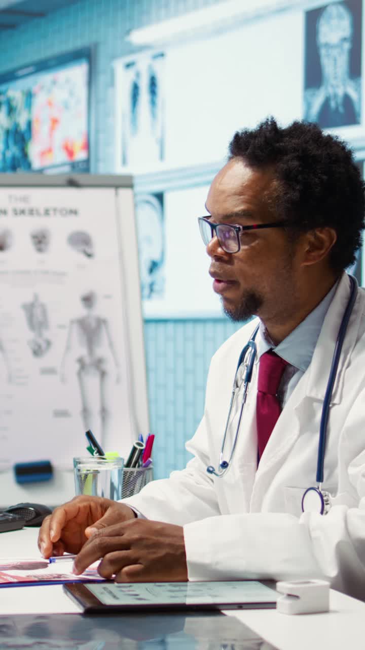 Doctor reading x ray imaging for a diagnostic report at consultation