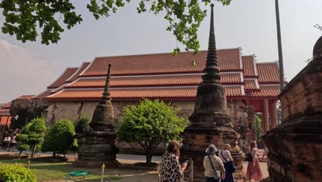 visitors walking around historic temple ruins