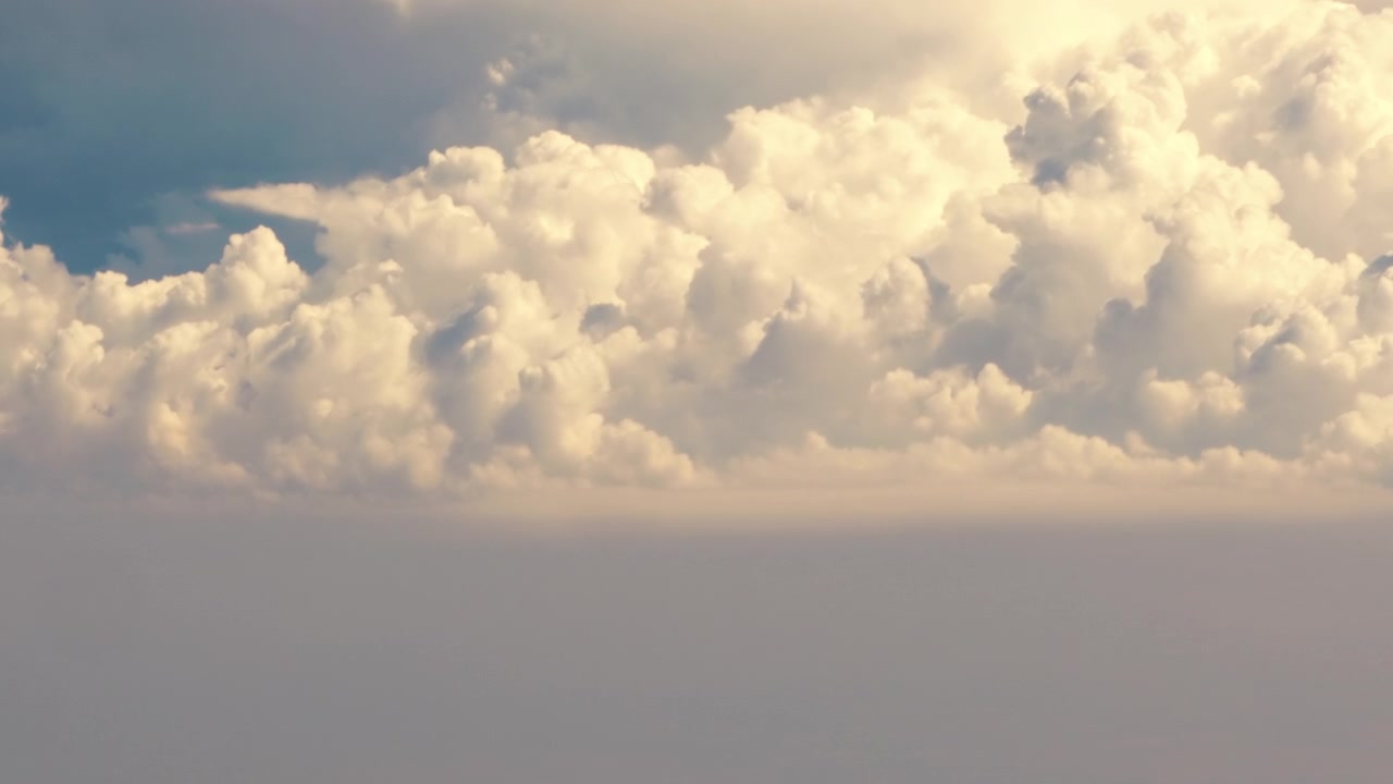 Beautiful Contrasting Dynamic Bright Clouds Seen from High Altitude.