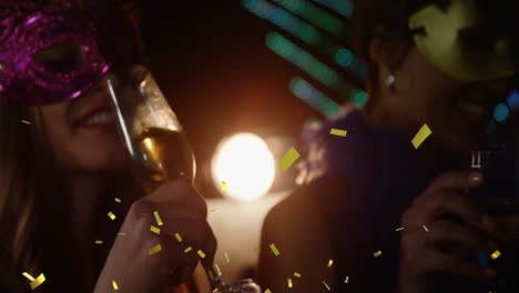 celebration with champagne glasses and confetti animation over people wearing masks