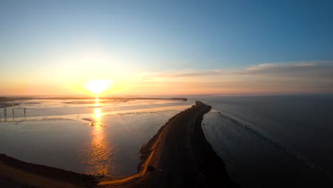 from the ground to the sky by the ocean at the sunrise drone aerial footage birds eye view