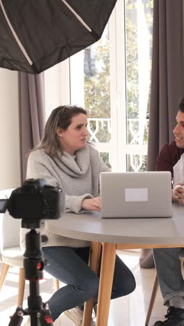 A group of people creating content for social media while making a video.