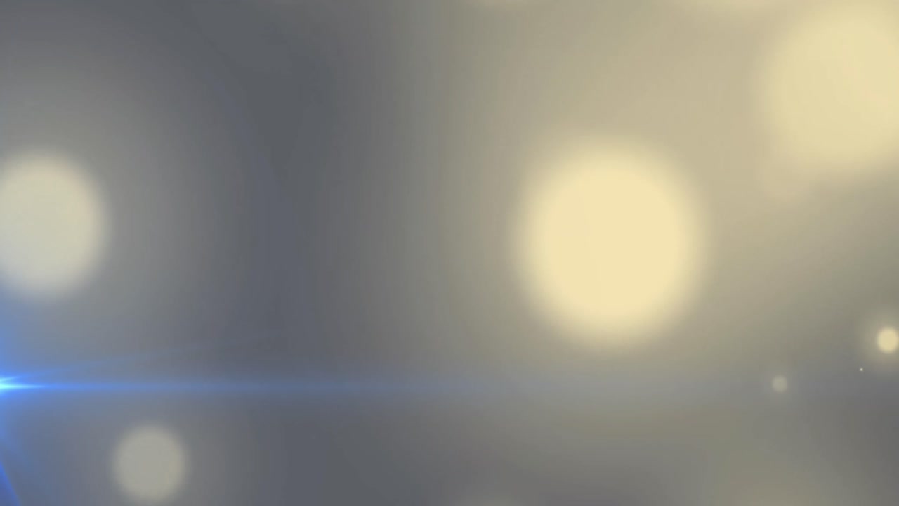 파란색 배경에 보케 빛의 노란색 반점의 디지털 애니메이션