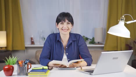 Happy-Female-student-reading-a-book.