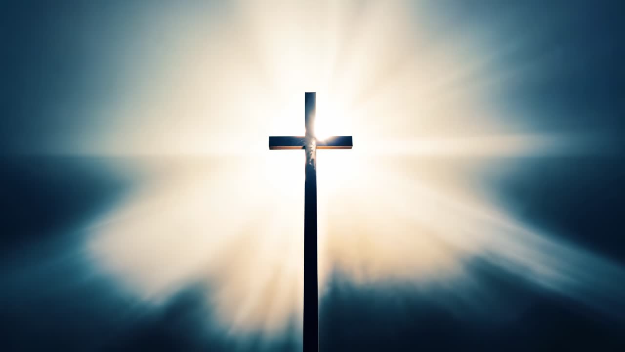 A cross silhouetted against radiant light, captured from a low angle