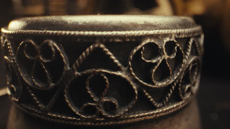 ornamental detail of a metal vessel