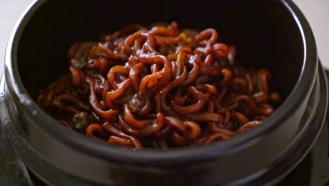 korean black spaghetti or instant noodle with roasted chajung soybean sauce - korean food style