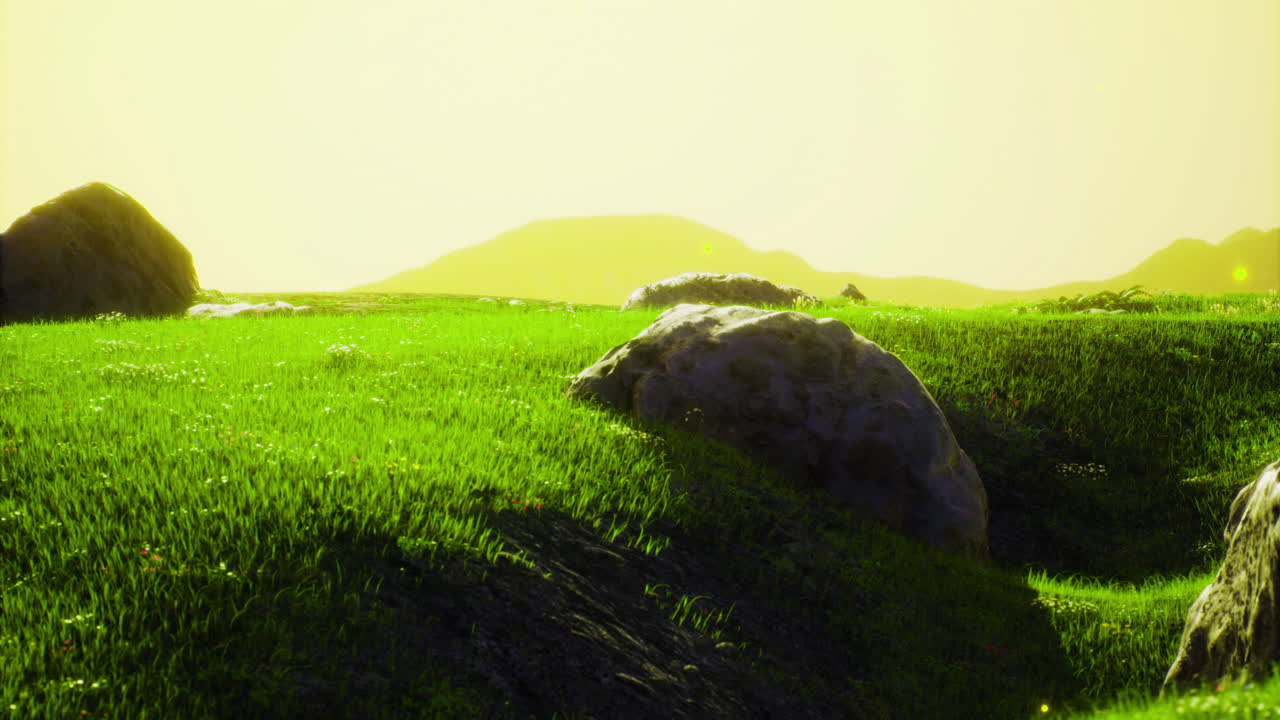 Serene landscape with green grass and distant hills during sunset hours
