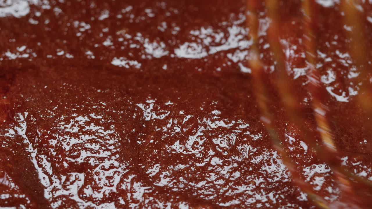 Close-up of a Brown Sauce Being Mixed or Prepared