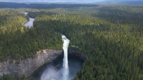 aerial circling canadas fourth highest waterfall, helmcken falls