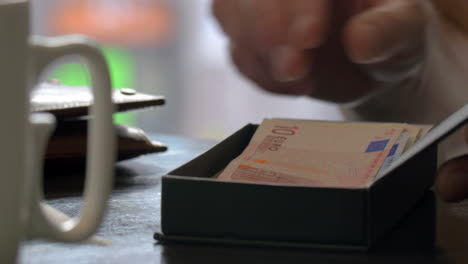 woman paying for dinner in cafe