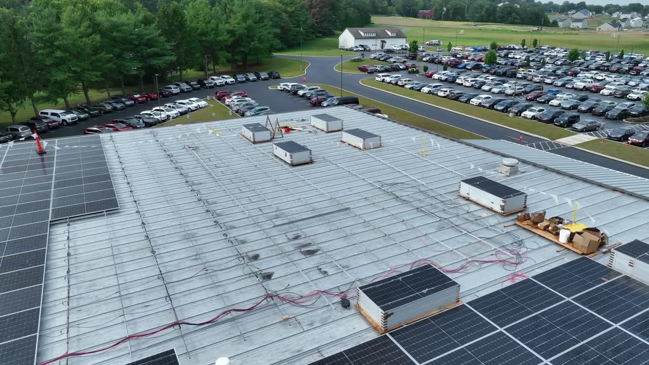 Premium stock video - Solar panels sitting on industrial roof waiting ...