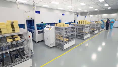 scientist or medical technicians in uniform works on vaccine injection manufacturing line glass vial bottle on a conveyor belt in a pharma production factory. production of medical dietary supplements