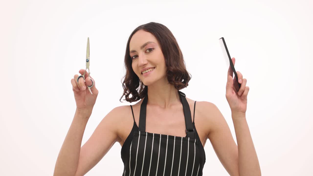Female Hairdresser Holding Scissors and Comb