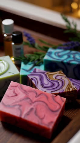 assorted marbled artisan soaps on a wooden tray