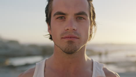 close up portrait of attractive man on beach touching hair charming muscular man relaxing