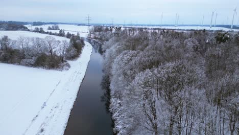 Winter-Snow-river-wood-forest-cloudy-sky-Germany